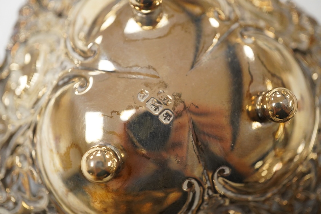 A pair of pierced silver circular bonbon dishes, maker JM, Birmingham, 1906, diameter 10.3cm, together with one other silver bonbon dish and two bonbon baskets, one silver, one stamped with U.S. sterling marks, 7.1oz.
